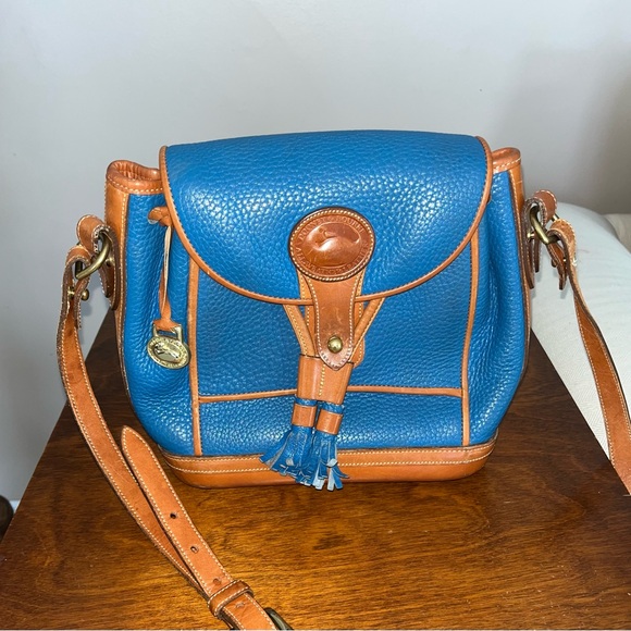 Dooney & Bourke Handbags - Dooney & Bourke Blue and Brown Leather Backpack